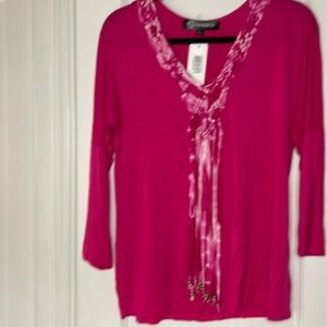 Women’s long sleeve top with front bead detail and asymmetrical back